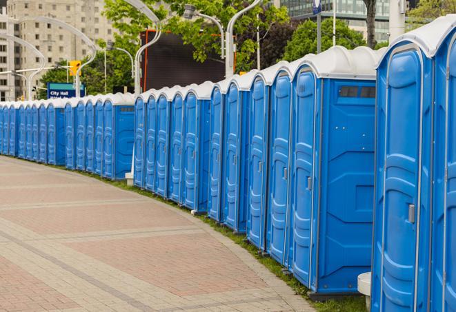 a row of portable restrooms set up for a special event, providing guests with a comfortable and sanitary option in Calcutta